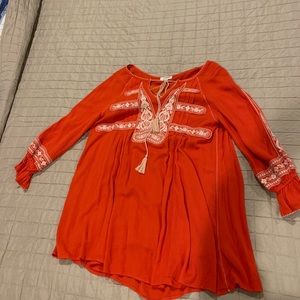 Orange dress with white embroidery